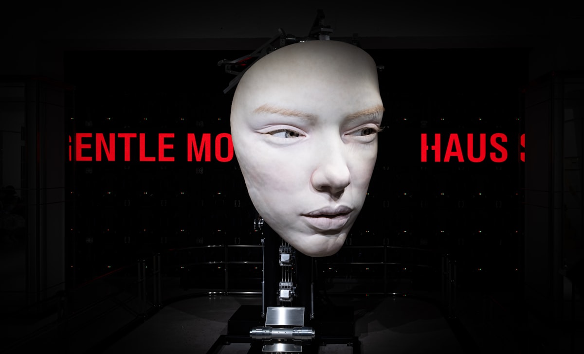 a white mannequin's head with a red sign in the background