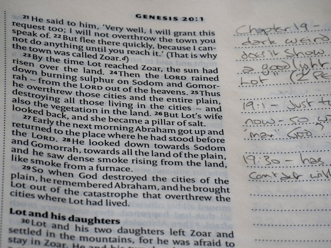 Close-up of an open bible with handwritten notes.