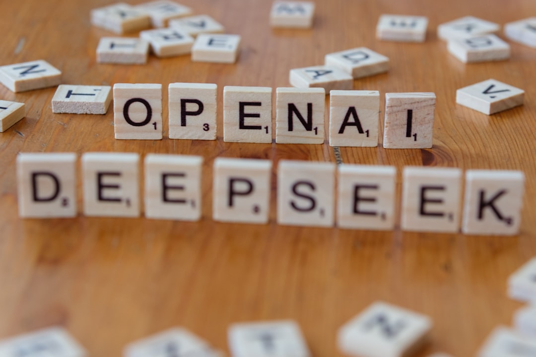 A wooden table topped with scrabble tiles spelling open and deep seek