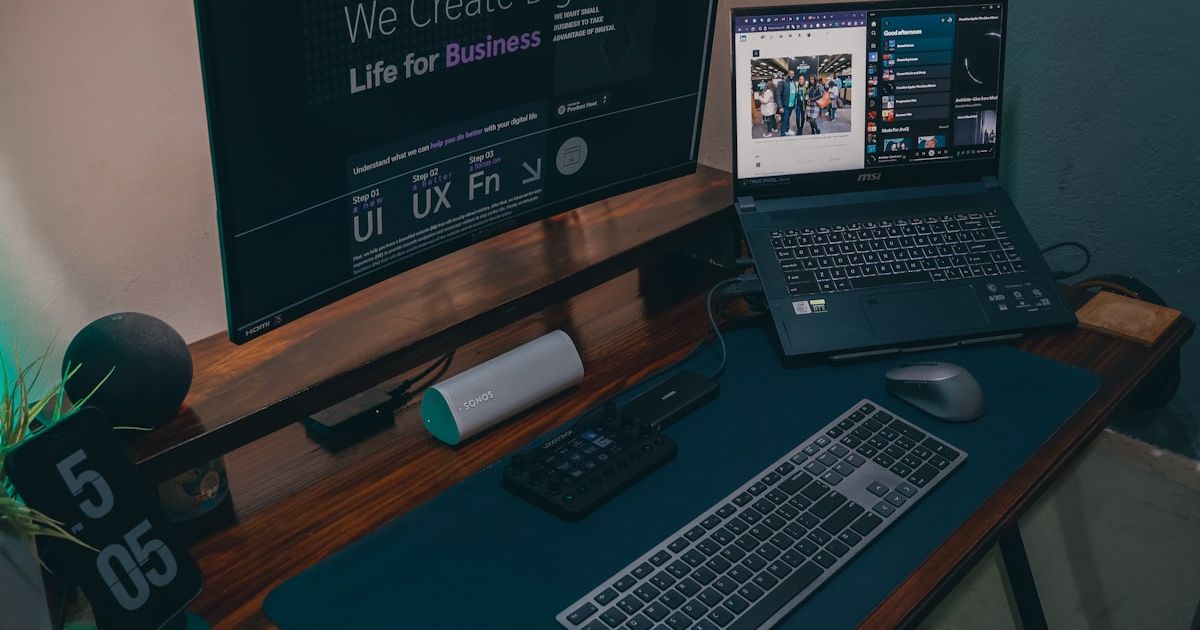 a laptop computer sitting on top of a wooden desk