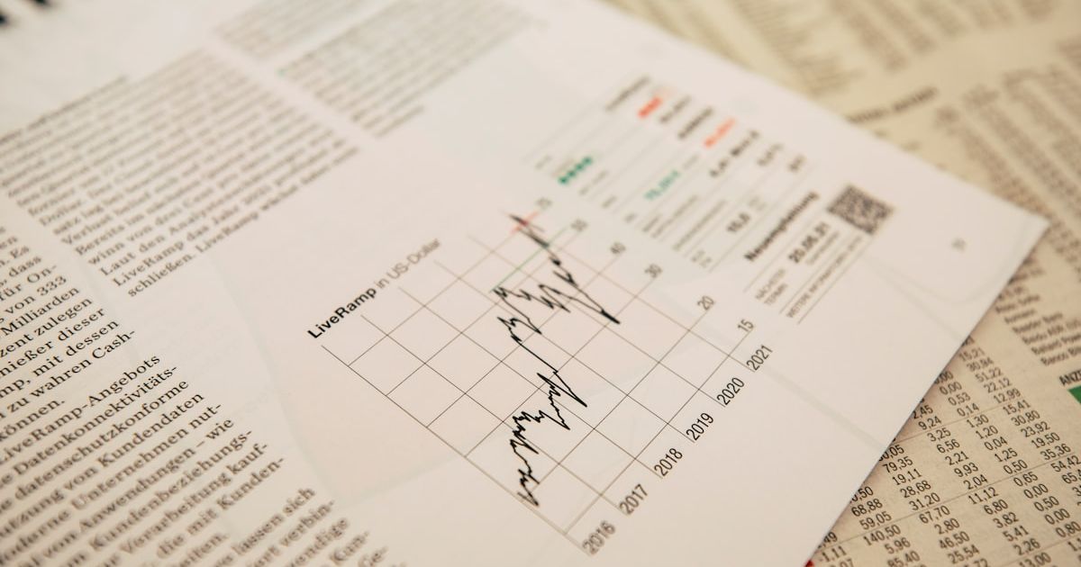 financial newspaper with stock chart